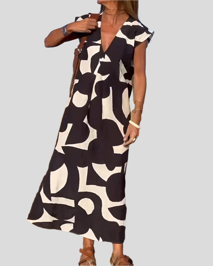 Sita | Dress with print and V-neckline