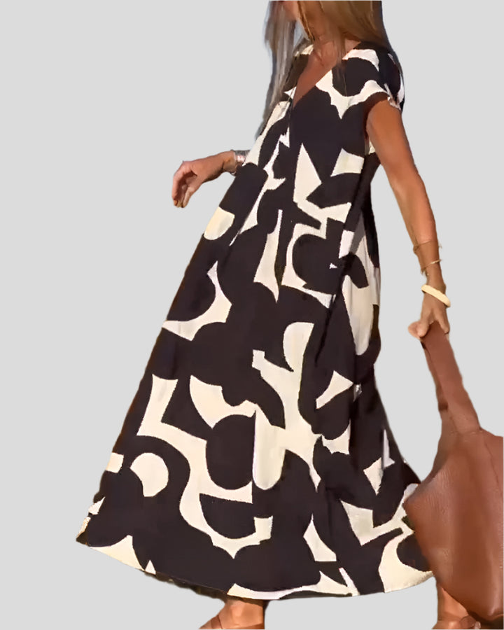 Sita | Dress with print and V-neckline